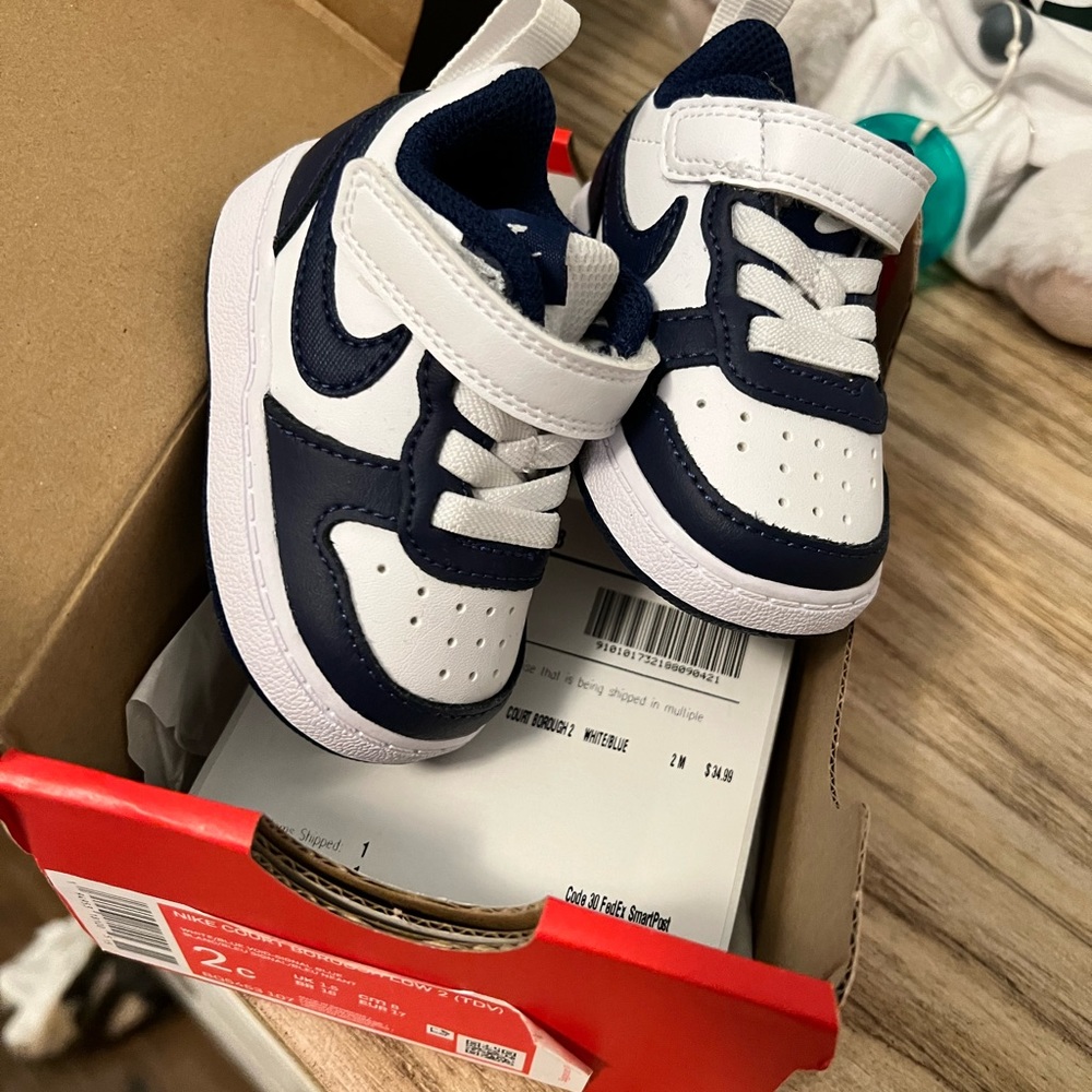 Infant size 2 Nike court lows